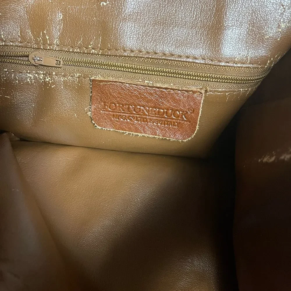 Fortune Duck vintage leather Brown sling back bucket style  bag.